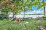 Fire pit and lawn games overlooking Hutchins Lake
